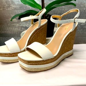 Size 7 white wedges.